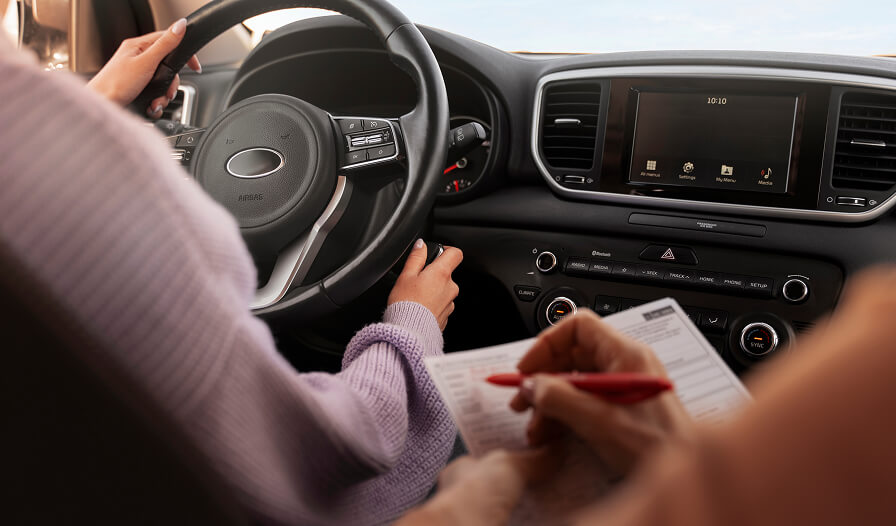 woman taking her driver s license test vehicle 1 1 1
